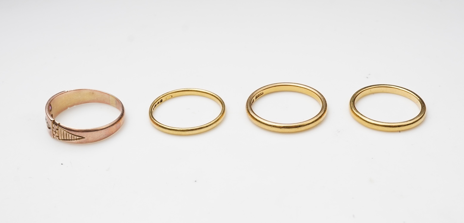 A collection of four gold rings